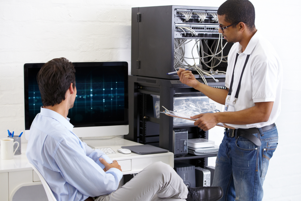 Two it professionals working together.