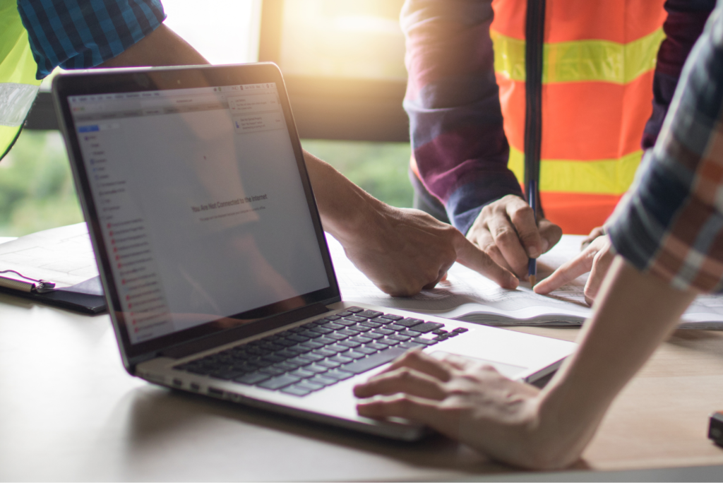 Laptop being used at a construction site.