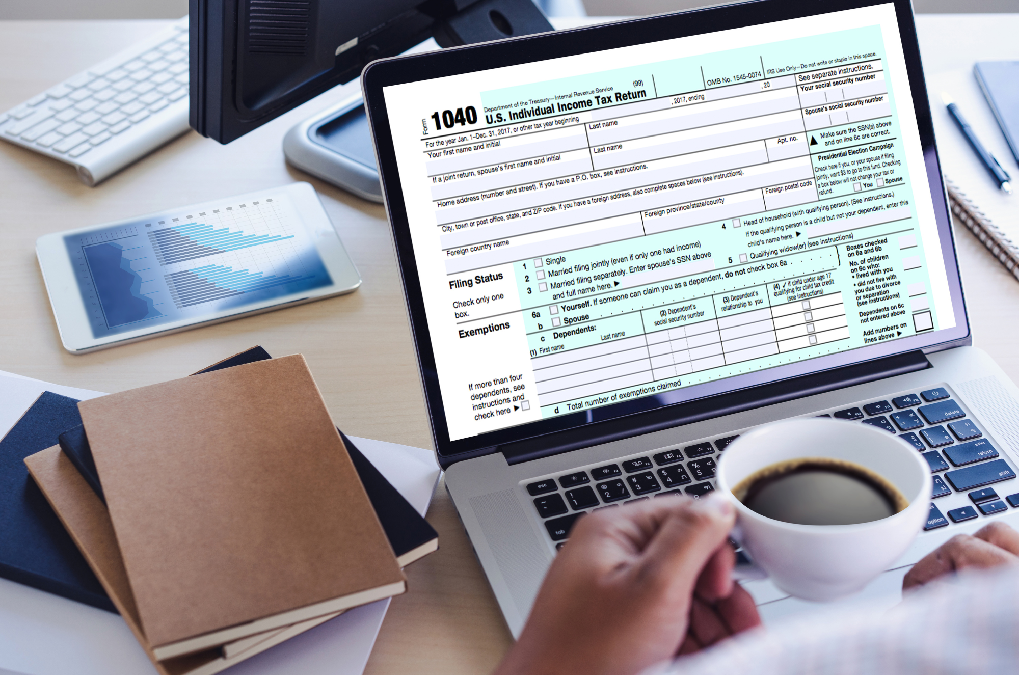 Accountant doing tax returns on a laptop.